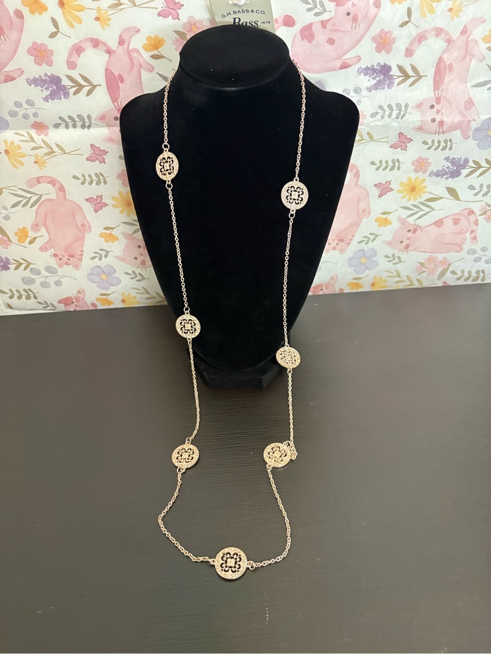 G.H. Bass & Co. Rose gold tone long necklace with filigree discs & rhinestones